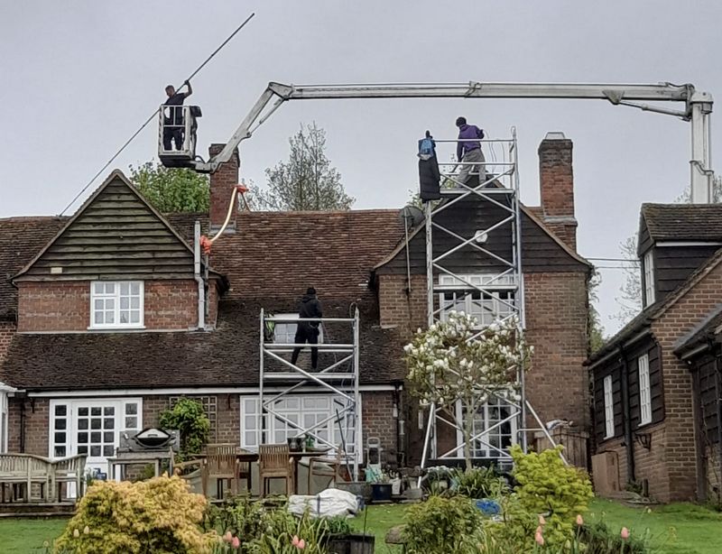 The Roof Moss Cleaners using cherry picker and scaffolding to clean roof safely and professionally in Marlow, Buckinghamshire