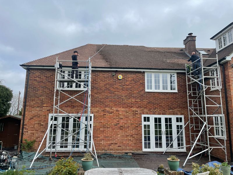Roof cleaning carried out safely from scaffold towers by The Roof Moss Cleaners in Marlow